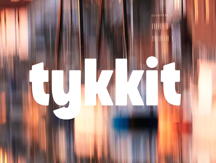 Example of a Tykkit logo on a busy background